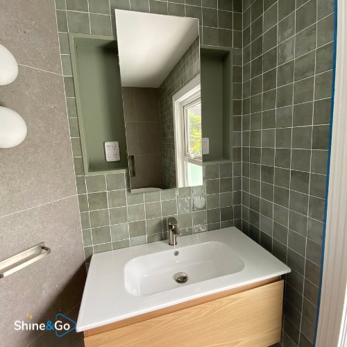 Bathroom vanity and tiled wall cleaned by Shine&Go NZ