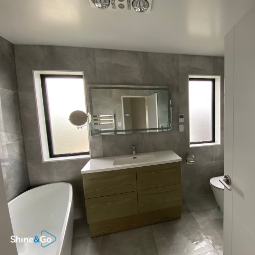 Bathroom with bathtub and vanity cleaned by Shine&Go NZ