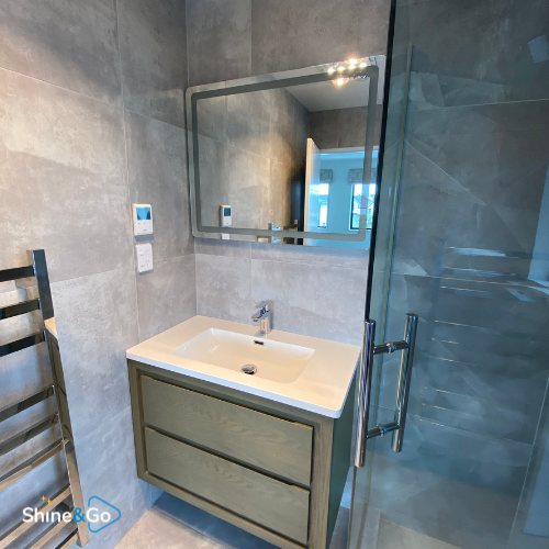 Bathroom vanity beside a glass shower, cleaned by Shine&Go NZ