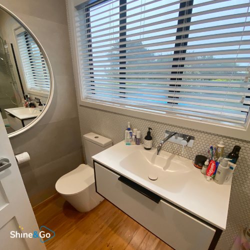 Bathroom with toilet and vanity cleaned by Shine&Go NZ