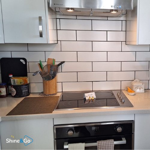 Kitchen stovetop with subway tile splashback cleaned by Shine&Go NZ